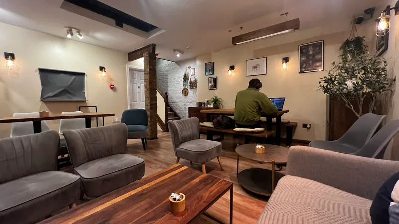 Cozy basement lounge with sofas and warm lighting
