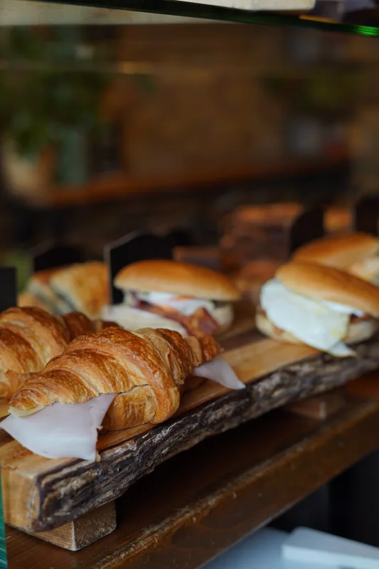 Fresh croissants and filled rolls in the pastry display