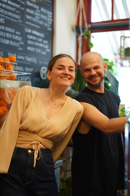 Two Coffee Matters team members smiling in the cafe
