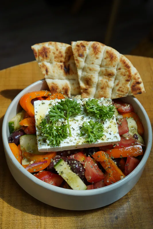 Greek salad with feta, olives and warm pita bread