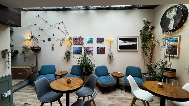 Main seating area with string lights and art
