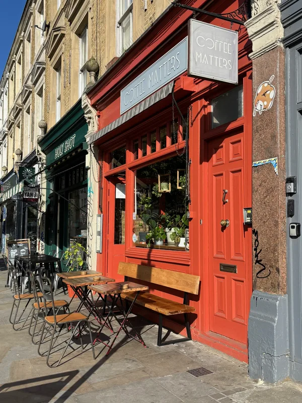 Coffee Matters storefront and outdoor seating in the sunshine